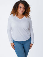 Micah is 5'9, size 10 and wears a size L # Women's White Long Sleeves | Fresh Clean Threads