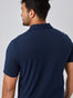 Navy Performance Polo Studio Back Angle | Fresh Clean Threads