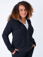 Micah is 5'9, size 10 and wears a size L # Women's Terry Zip-Up Hooded Sweatshirt | Fresh Clean Threads