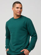 Mikah is 6'1" and wears a size medium # Dark Emerald Crew Sweatshirt | New Style | Fresh Clean Threads